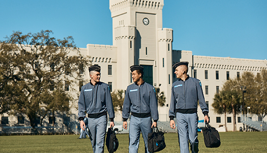 A group of military students walking out of college building